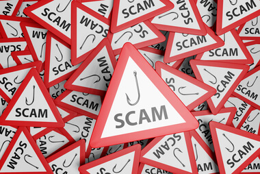 IRS tax scams 2026 warning graphic with red triangles showing fishing hooks and the word “scam”
