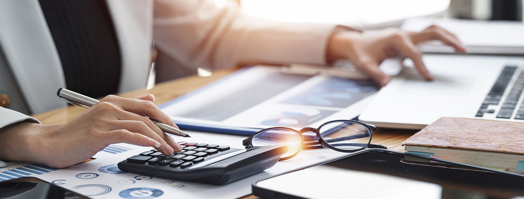 Woman doing paperwork and taxes at home office