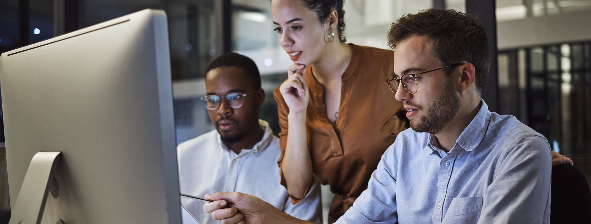 Business partners looking at computer together