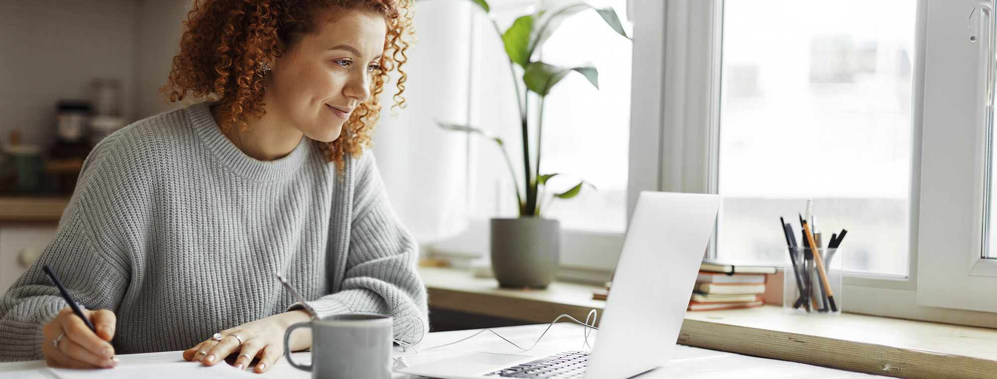 Woman looking at computer at home